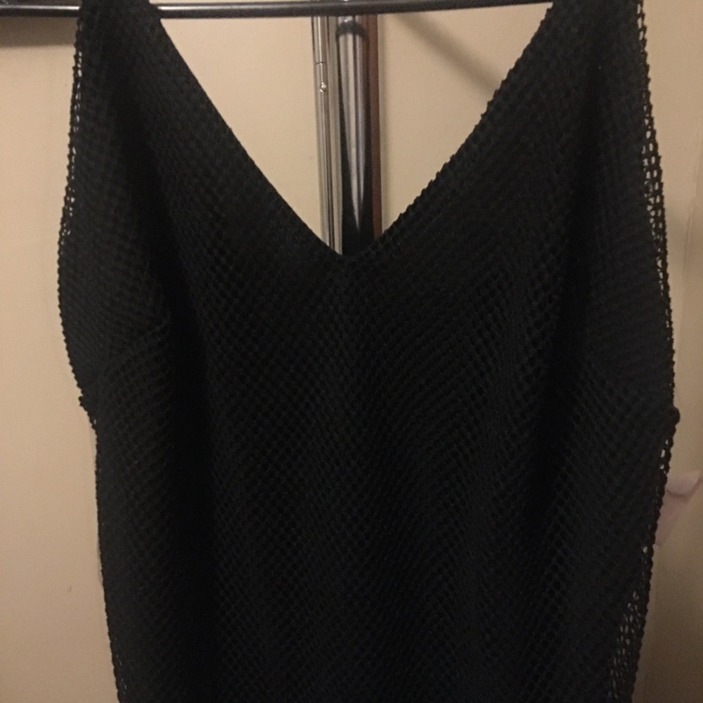 One piece bathing suit with fishnet cover attached